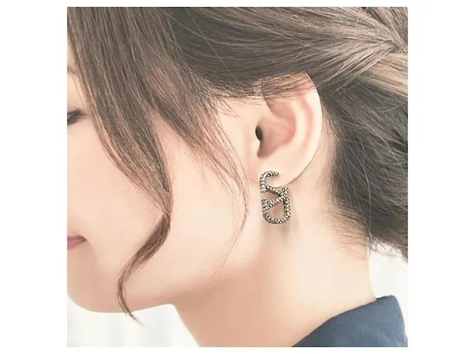 Pendientes de mujer Valentino con firma de logo V 