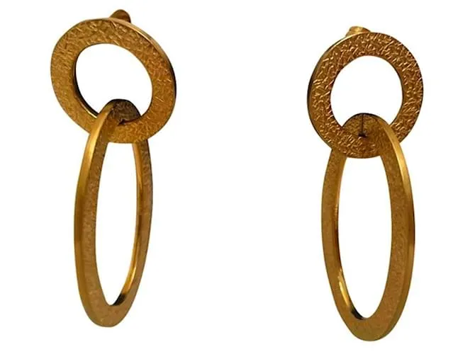 Pendientes dorados DOLCE & GABBANA con círculo alargado y logo 