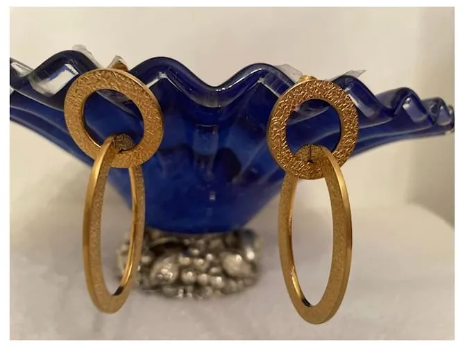 Pendientes dorados DOLCE & GABBANA con círculo alargado y logo 