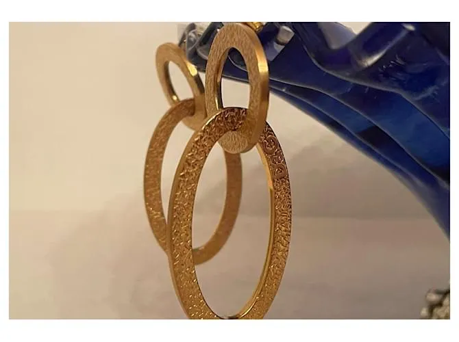Pendientes dorados DOLCE & GABBANA con círculo alargado y logo 